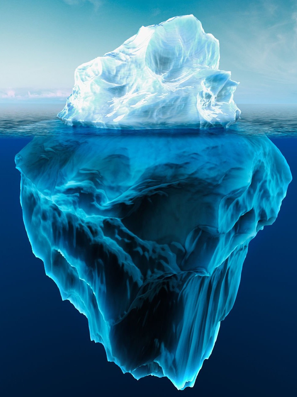 An iceberg with a small tip above the waterline and a large mass hidden below the surface.