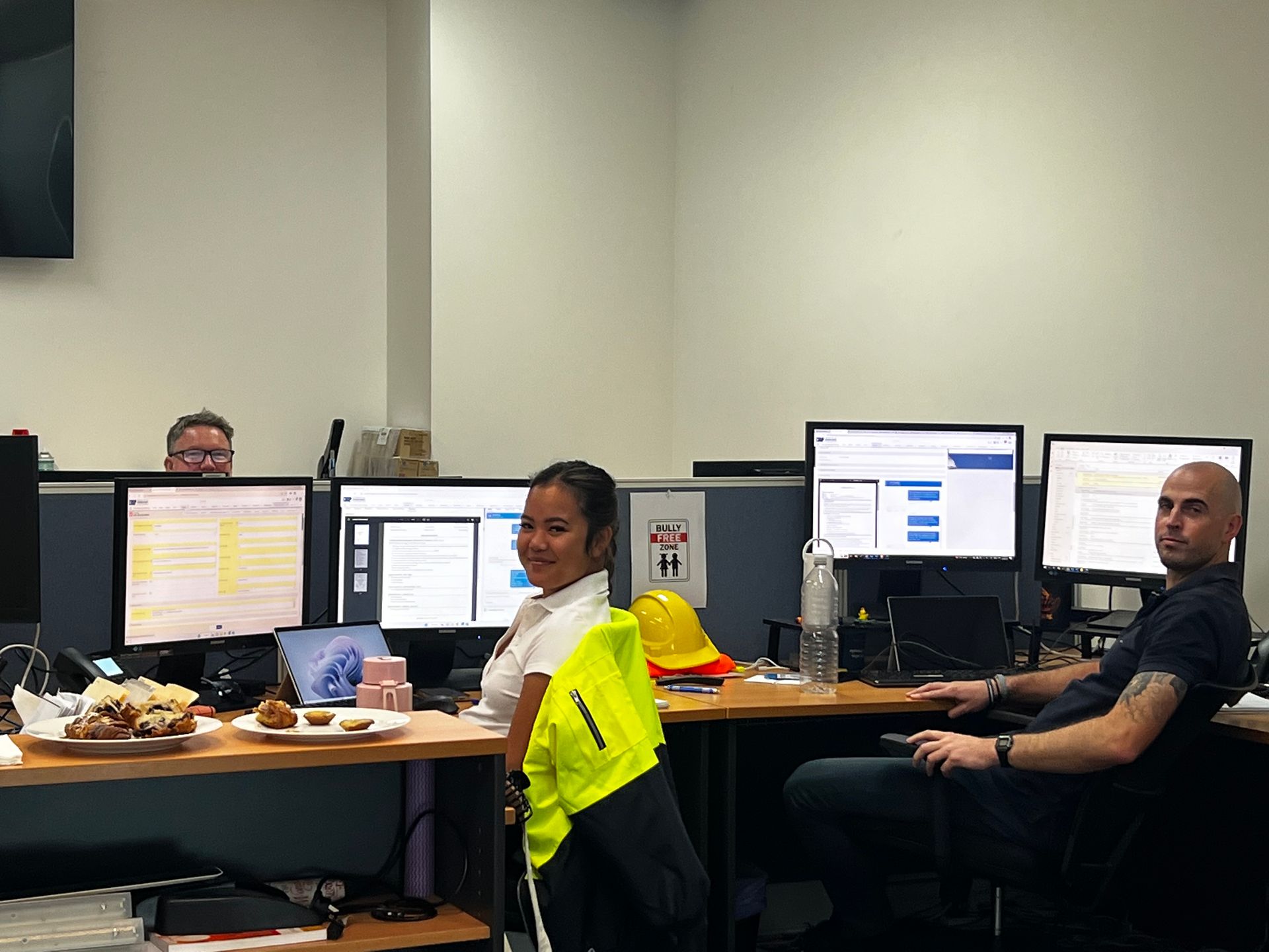 IRP recruitment consultants working at computer workstations in the office.